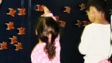 Children rearranging synchronized infrared "fireflies"