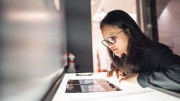Student looking at photo negatives