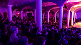 Image of audience with a corner of the Great Hall stage