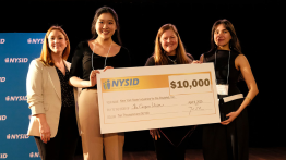 Students receive $10K large check from NYSID