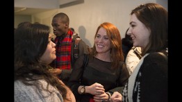 Tamara Robertson and Jenn Halweil talking to a student after the panel discussion
