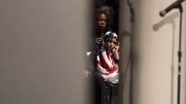 The daughter of a NYC police officer sat with her family on stage
