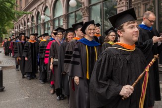 Sean Cusack BSE'98 (foreground) with assembled faculty